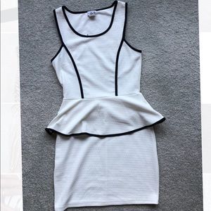 Black and white peplum workwear dress.